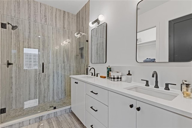 bathroom featuring hardwood / wood-style flooring, vanity, and a shower with shower door