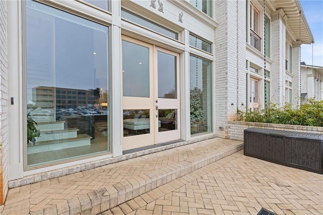 doorway to property with a patio area and french doors