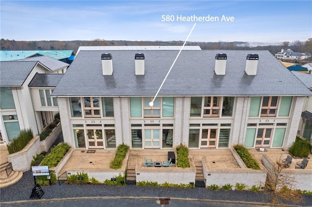 rear view of property with french doors