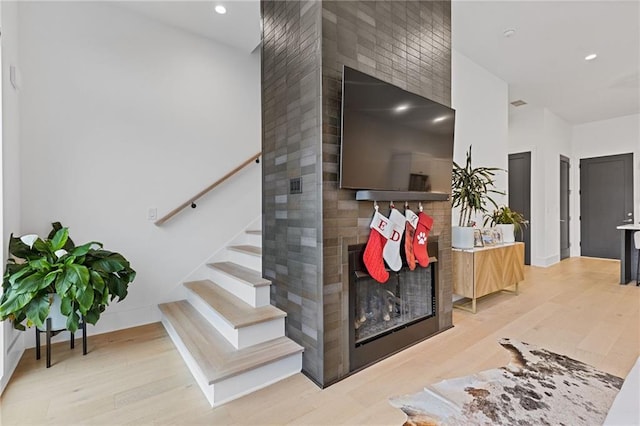 stairway featuring hardwood / wood-style floors