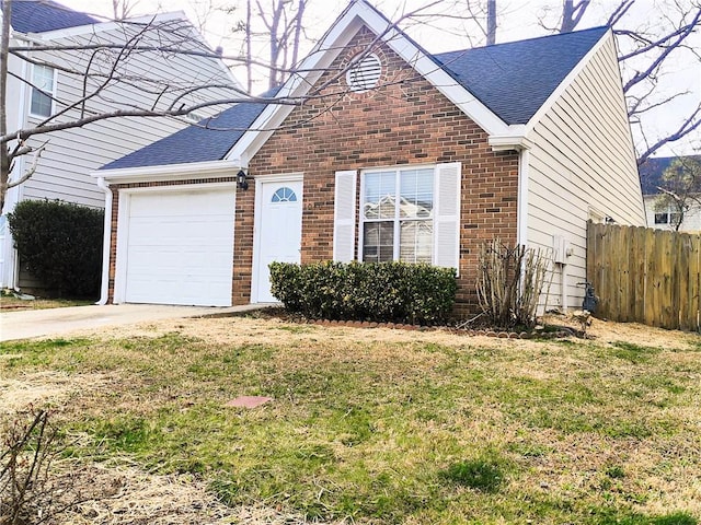 view of front of property featuring a front lawn and a garage