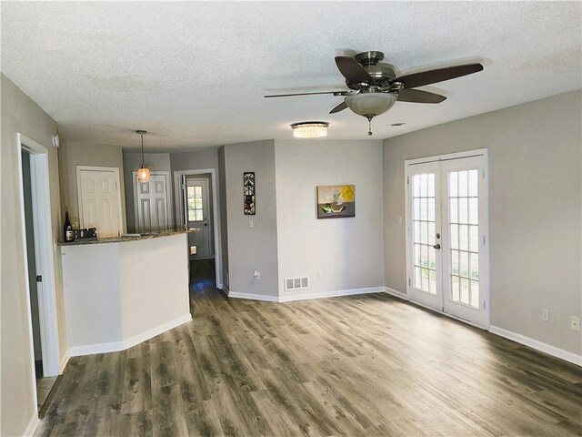 kitchen with ceiling fan, dishwasher, sink, kitchen peninsula, and decorative light fixtures