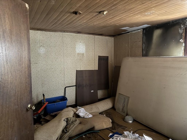 basement featuring wooden ceiling