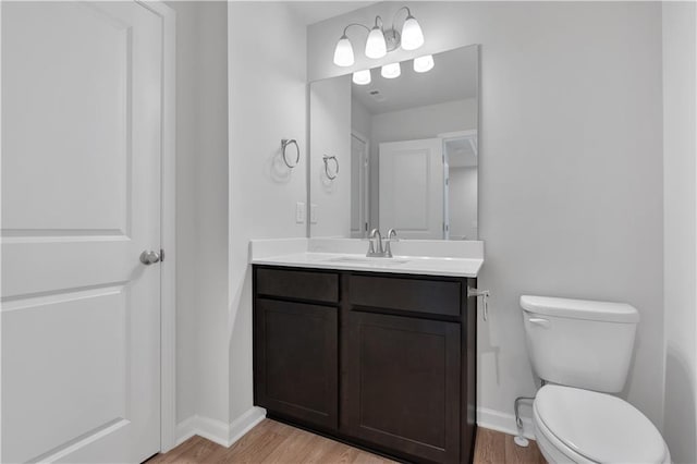 105 Village Green Dr Unit 171, Adairsville, GA 30103 - bathroom with toilet, vanity, baseboards, and wood finished floors