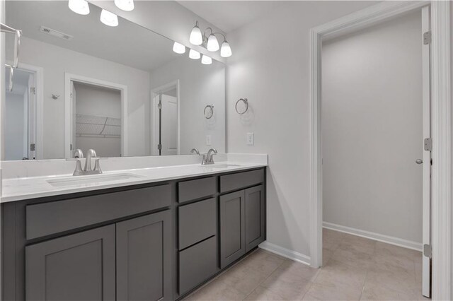 105 Village Green Dr Unit 171, Adairsville, GA 30103 - bathroom with double vanity, a sink, baseboards, and visible vents