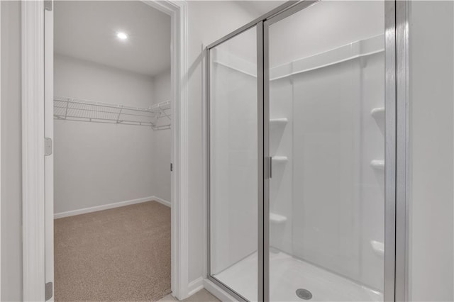 105 Village Green Dr Unit 171, Adairsville, GA 30103 - bathroom featuring a shower stall, baseboards, and a walk in closet