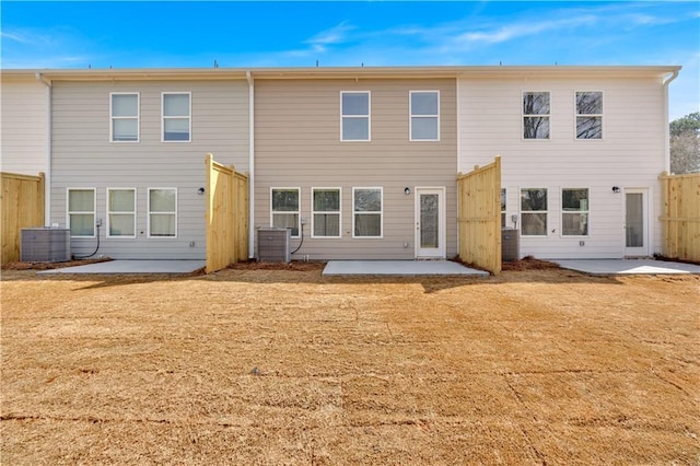 105 Village Green Dr Unit 171, Adairsville, GA 30103 - rear view of property featuring a patio, fence, central AC, and a lawn
