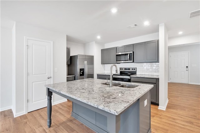 105 Village Green Dr Unit 171, Adairsville, GA 30103 - kitchen with light wood-type flooring, a sink, stainless steel appliances, and visible vents