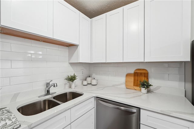 4282 Worth St NW, Acworth, GA 30101 - kitchen with backsplash, white cabinets, stainless steel dishwasher, and a sink