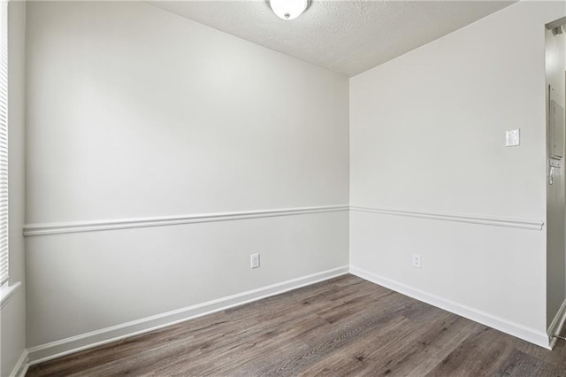 4282 Worth St NW, Acworth, GA 30101 - empty room with wood finished floors, a textured ceiling, and baseboards