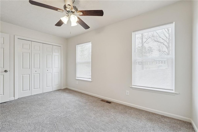 4282 Worth St NW, Acworth, GA 30101 - unfurnished bedroom featuring a closet, multiple windows, visible vents, and carpet