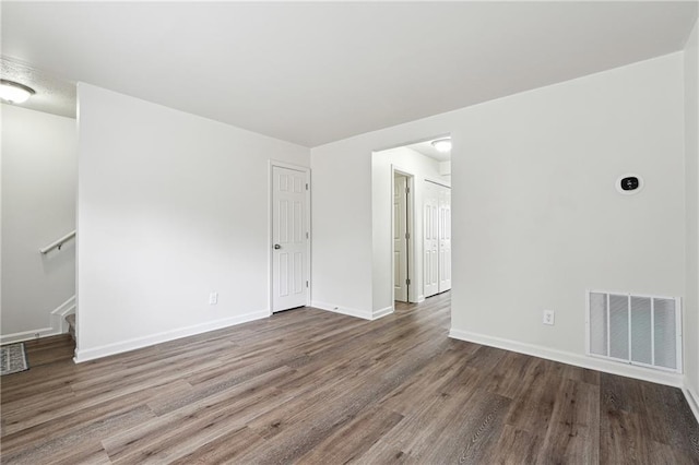 4282 Worth St NW, Acworth, GA 30101 - spare room with baseboards, wood finished floors, visible vents, and stairs