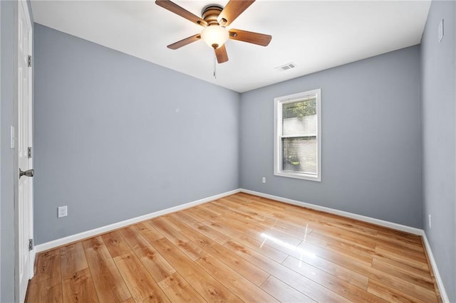 spare room with ceiling fan and light hardwood / wood-style floors