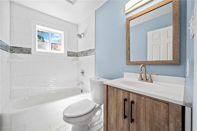 full bathroom featuring vanity, toilet, and tiled shower / bath combo