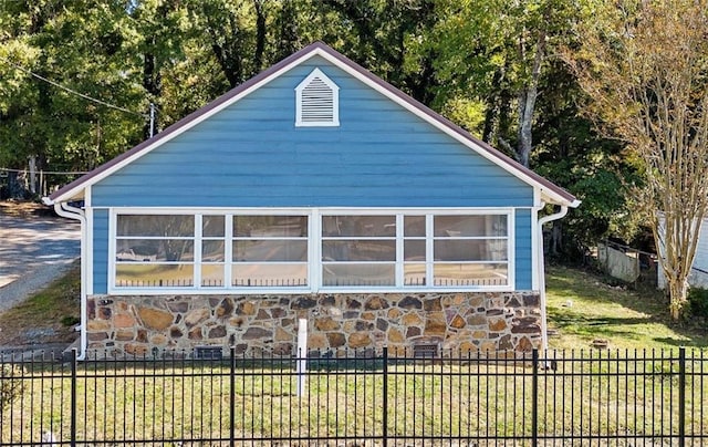 view of property exterior with a lawn