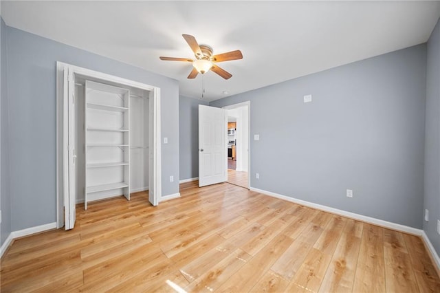 unfurnished bedroom featuring ceiling fan and light wood-type flooring