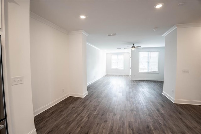 unfurnished room featuring dark hardwood / wood-style flooring, crown molding, and ceiling fan