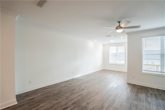 unfurnished room with ornamental molding, dark hardwood / wood-style floors, and ceiling fan