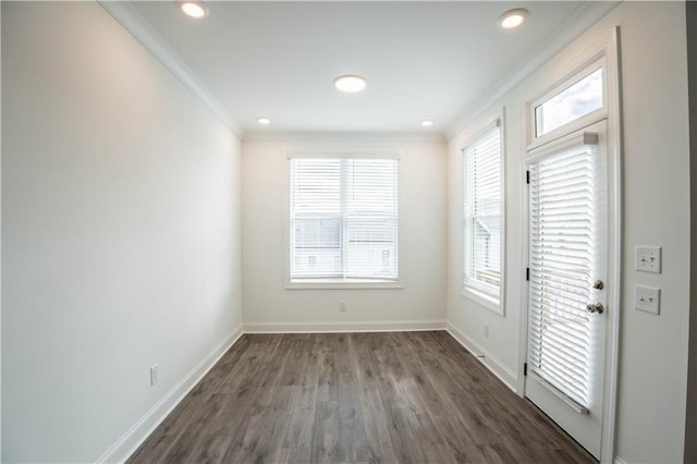 interior space with dark wood-type flooring and ornamental molding