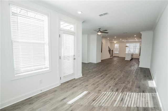 interior space featuring hardwood / wood-style flooring and ceiling fan