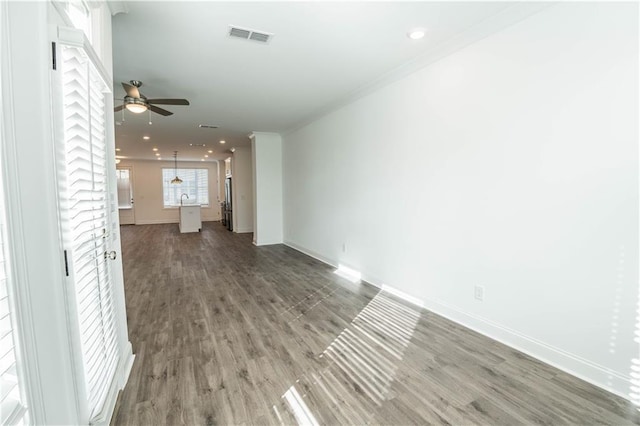 unfurnished living room featuring wood-type flooring and ceiling fan