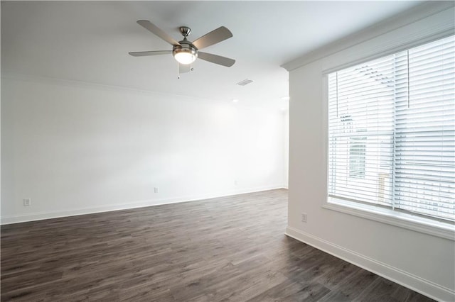 unfurnished room with dark hardwood / wood-style flooring, crown molding, and ceiling fan