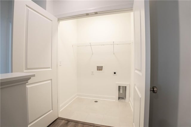 washroom with hookup for a washing machine, dark hardwood / wood-style floors, and hookup for an electric dryer