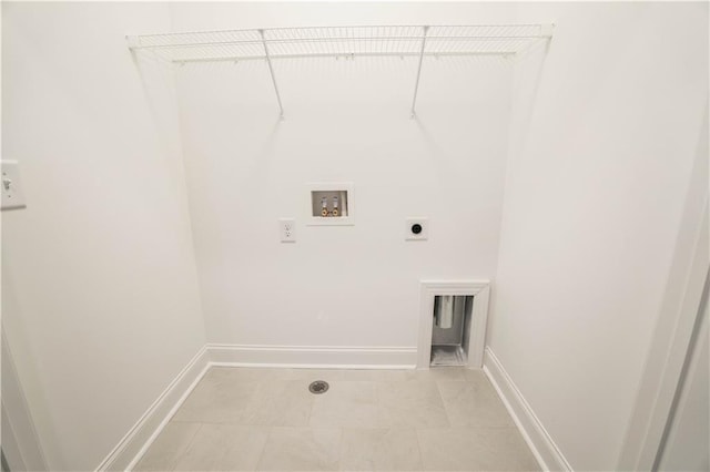 laundry room with washer hookup, light tile patterned floors, and hookup for an electric dryer