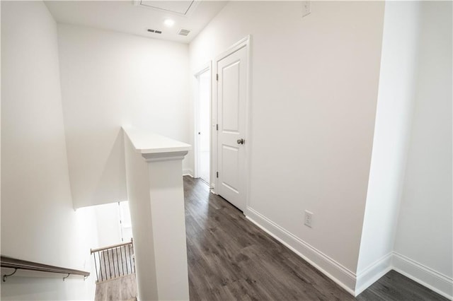 hall with dark hardwood / wood-style flooring