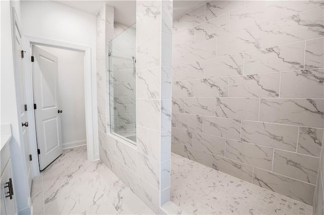 bathroom with a tile shower