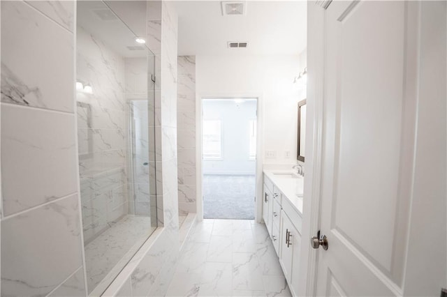 bathroom featuring walk in shower and vanity