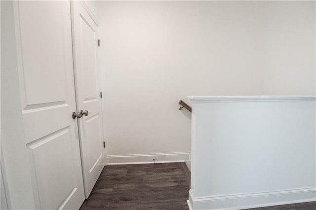 staircase with hardwood / wood-style flooring