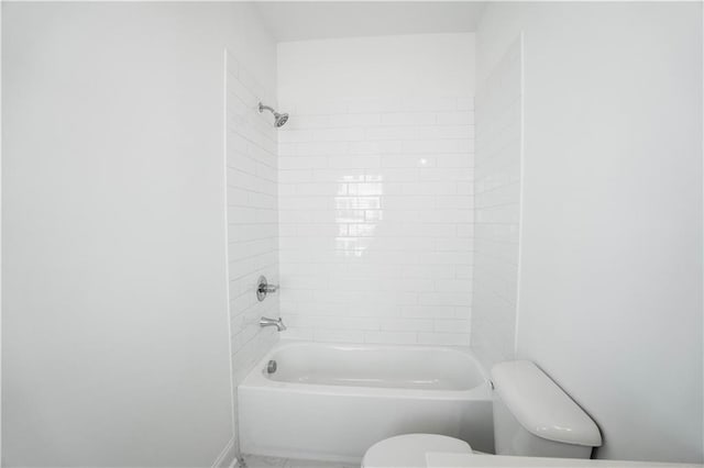 bathroom featuring toilet and shower / bathing tub combination