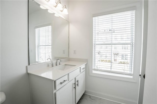 bathroom featuring vanity and a wealth of natural light