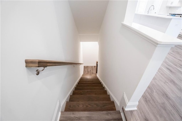 stairs with wood-type flooring