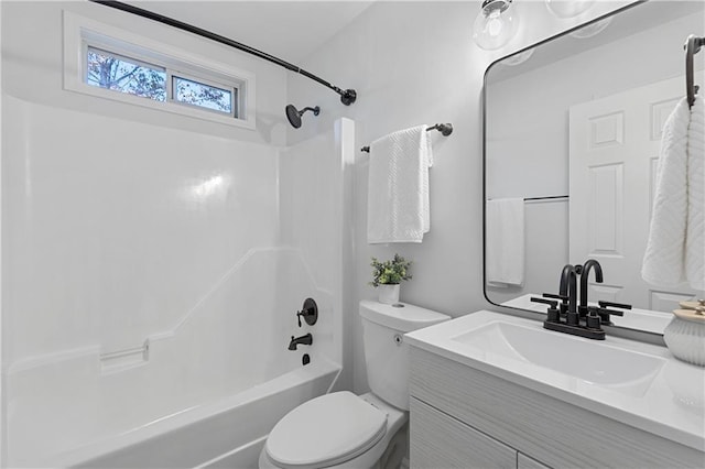 full bathroom with vanity, toilet, and washtub / shower combination