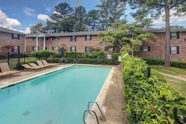 view of swimming pool with a patio area