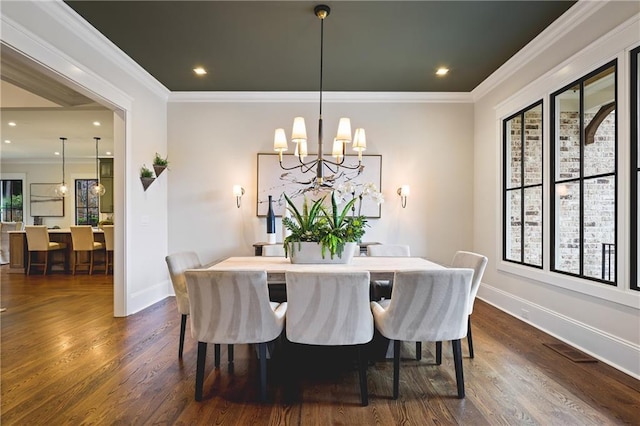 11 Brownson Ct, Acworth, GA 30101 - dining room with a chandelier, dark wood finished floors, baseboards, crown molding, and recessed lighting