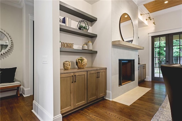 11 Brownson Ct, Acworth, GA 30101 - bar featuring dark wood finished floors, a tiled fireplace, baseboards, crown molding, and recessed lighting