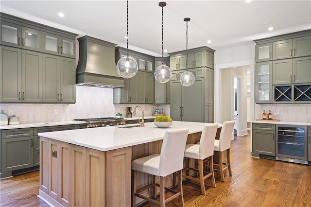 11 Brownson Ct, Acworth, GA 30101 - kitchen with beverage cooler, custom range hood, a sink, tasteful backsplash, and light countertops