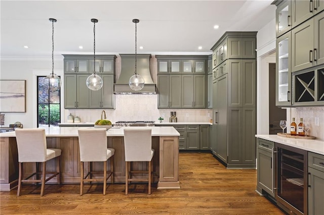 11 Brownson Ct, Acworth, GA 30101 - kitchen with wine cooler, custom range hood, light countertops, glass insert cabinets, and recessed lighting