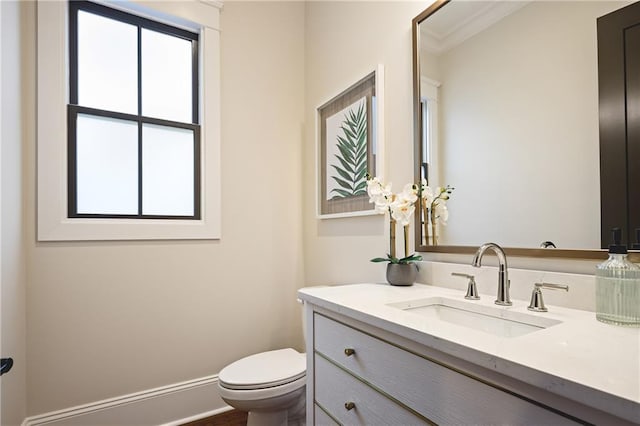 11 Brownson Ct, Acworth, GA 30101 - bathroom featuring toilet, vanity, and ornamental molding