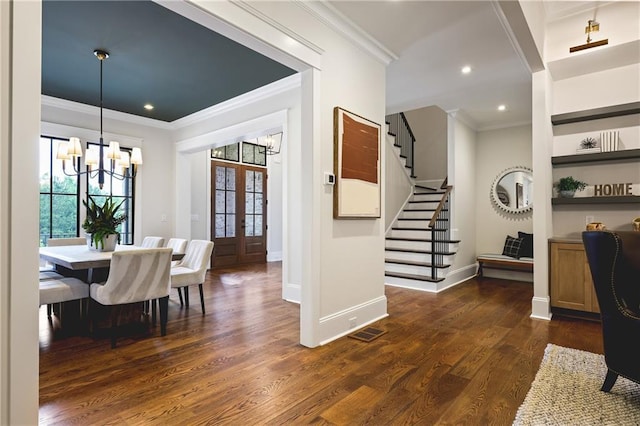 11 Brownson Ct, Acworth, GA 30101 - dining area featuring crown molding, a chandelier, stairs, dark wood-style flooring, and french doors