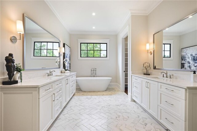 11 Brownson Ct, Acworth, GA 30101 - full bath with healthy amount of natural light, two vanities, a soaking tub, ornamental molding, and recessed lighting