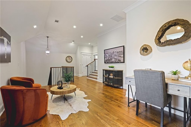 11 Brownson Ct, Acworth, GA 30101 - living area featuring wood finished floors, baseboards, crown molding, stairs, and vaulted ceiling