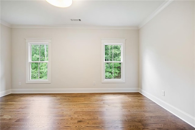 11 Brownson Ct, Acworth, GA 30101 - spare room with healthy amount of natural light, ornamental molding, wood finished floors, and baseboards