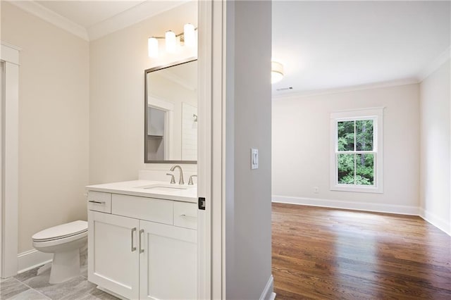 11 Brownson Ct, Acworth, GA 30101 - bathroom with ornamental molding, vanity, wood finished floors, toilet, and baseboards