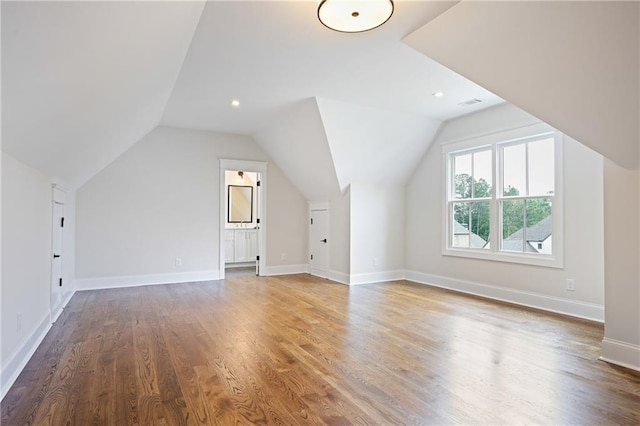 11 Brownson Ct, Acworth, GA 30101 - additional living space featuring wood finished floors, vaulted ceiling, and baseboards