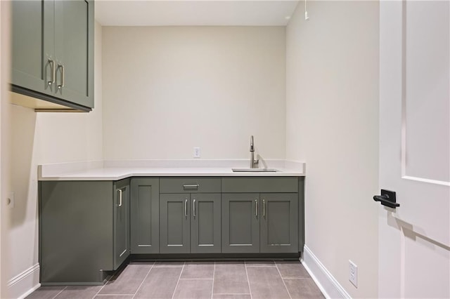 11 Brownson Ct, Acworth, GA 30101 - laundry area with a sink, baseboards, and light tile patterned flooring