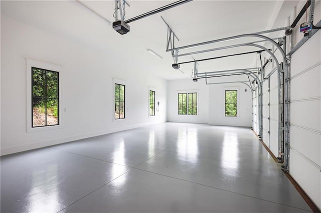 11 Brownson Ct, Acworth, GA 30101 - garage featuring a garage door opener and baseboards